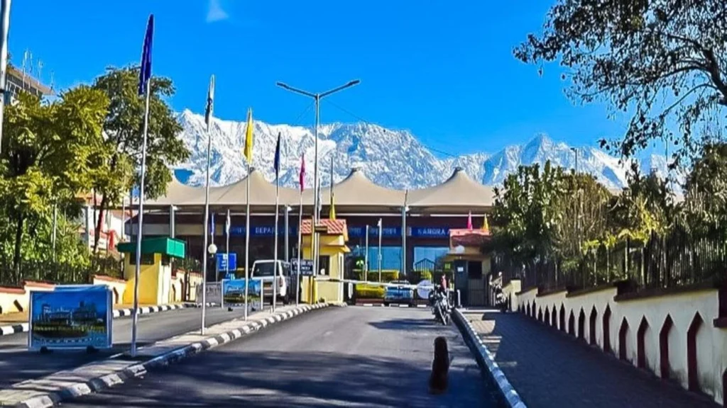 A plane landing at Kangra Airport with the Himalayas in the background — best places to visit in summer in India for easy hill station access.