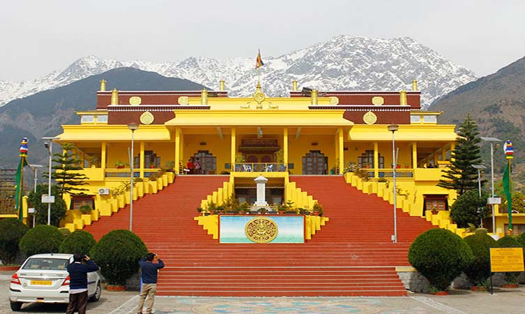 Namgyal Monastery with prayer flags fluttering and Himalayan backdrop — best places to visit in summer in India for spiritual peace and Tibetan culture.