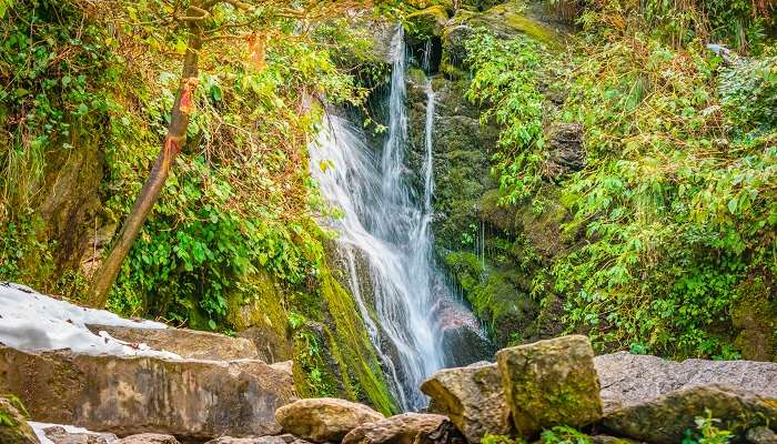 Panchpula waterfall and forest trails in Dalhousie — best places to visit in summer in India for nature walks and relaxation.