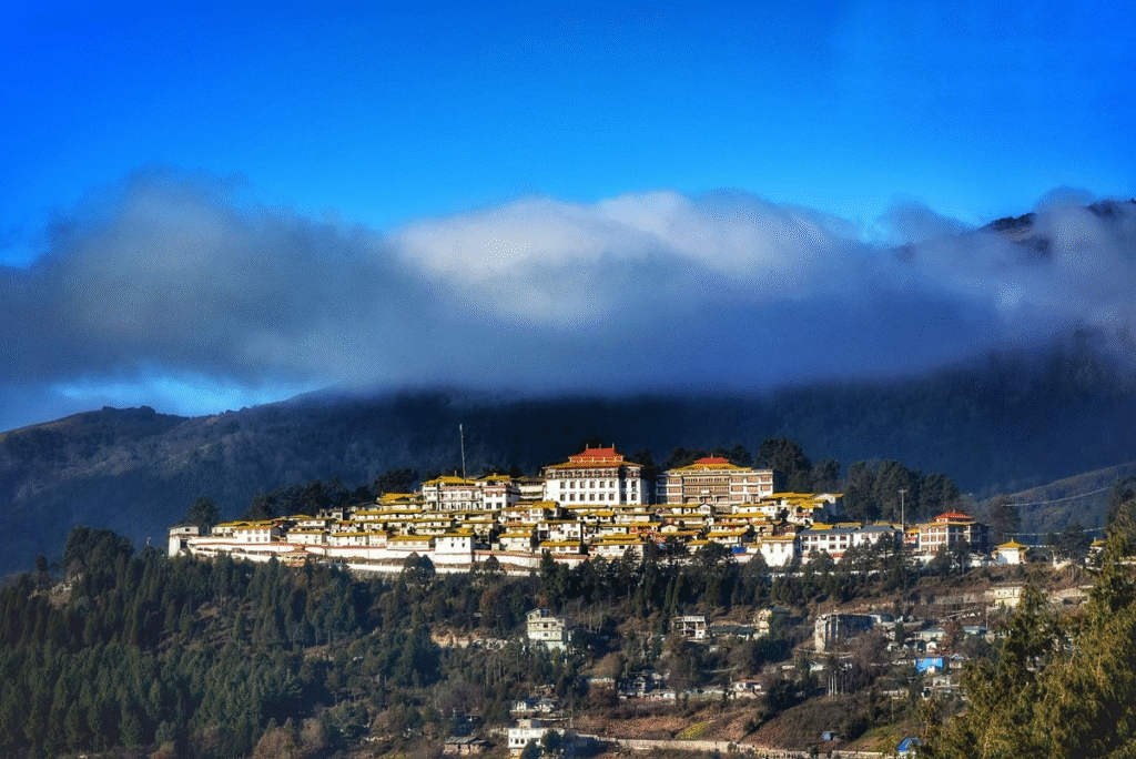 Snow-covered mountains and colorful prayer flags in Tawang — a remote Himalayan retreat and one of the best places in India to travel solo.